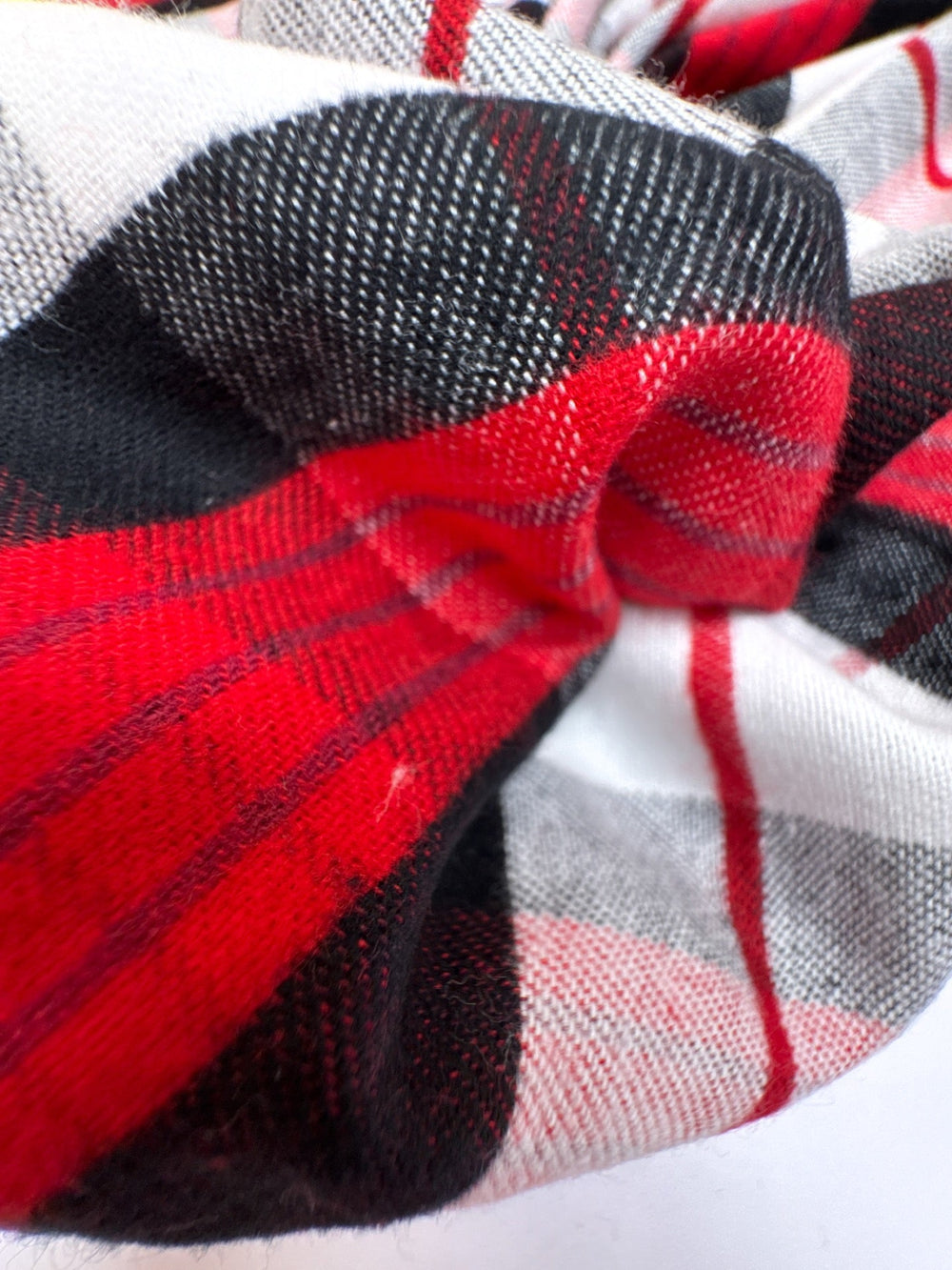 Italian cotton flannel fabric in large white, black, and red plaid, lightweight textile ideal for shirts, blouses, and casual wear.