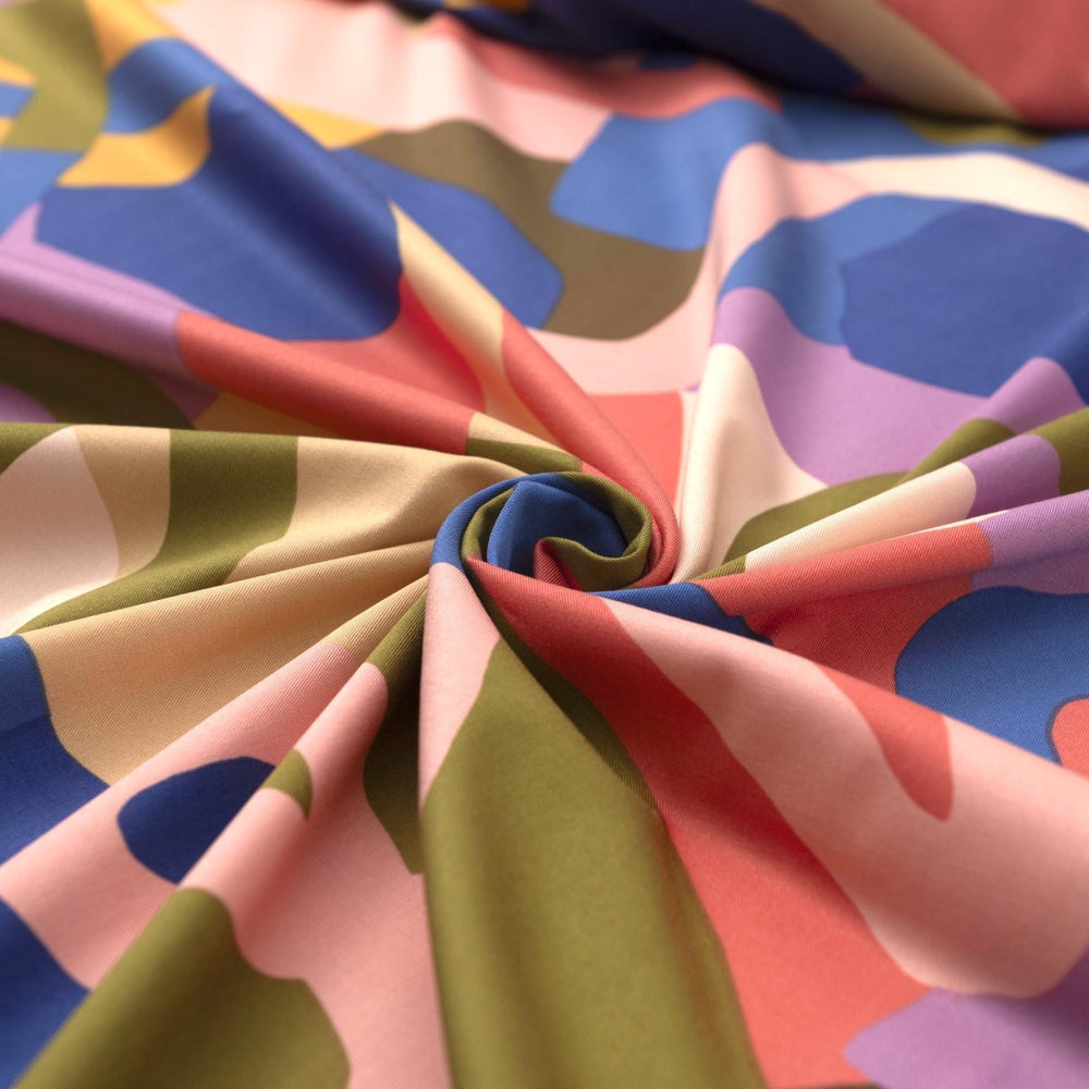 Rosella Natural Flow viscose woven stretch fabric by Nerida Hansen in moss green, coral, cobalt, lilac and beige tones with satin finish
