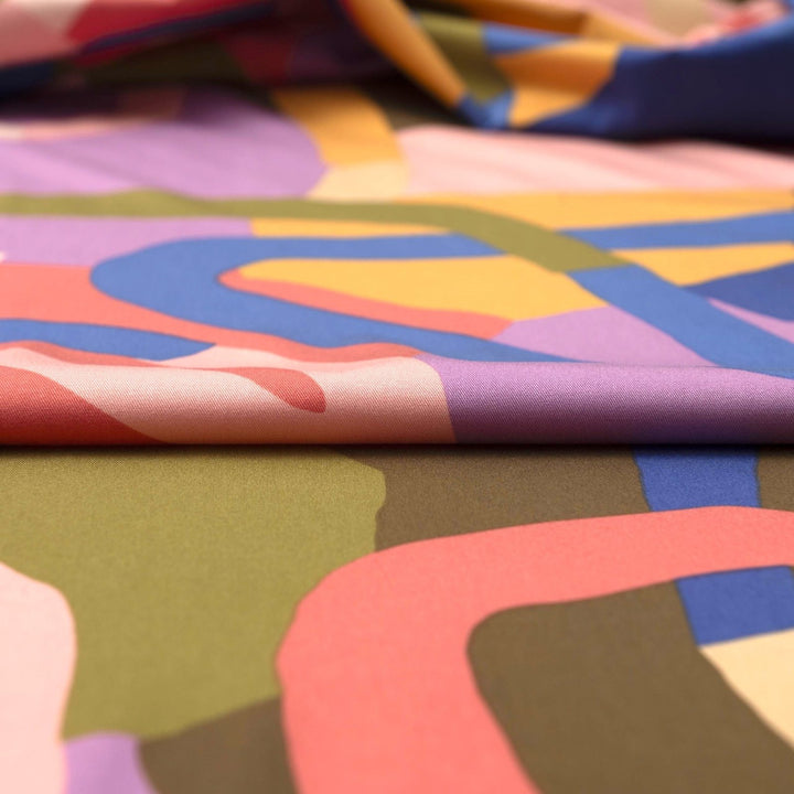 Rosella Natural Flow viscose woven stretch fabric by Nerida Hansen in moss green, coral, cobalt, lilac and beige tones with satin finish