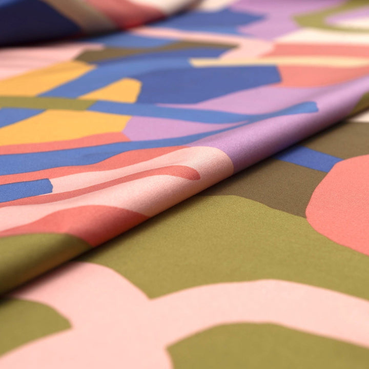 Rosella Natural Flow viscose woven stretch fabric by Nerida Hansen in moss green, coral, cobalt, lilac and beige tones with satin finish
