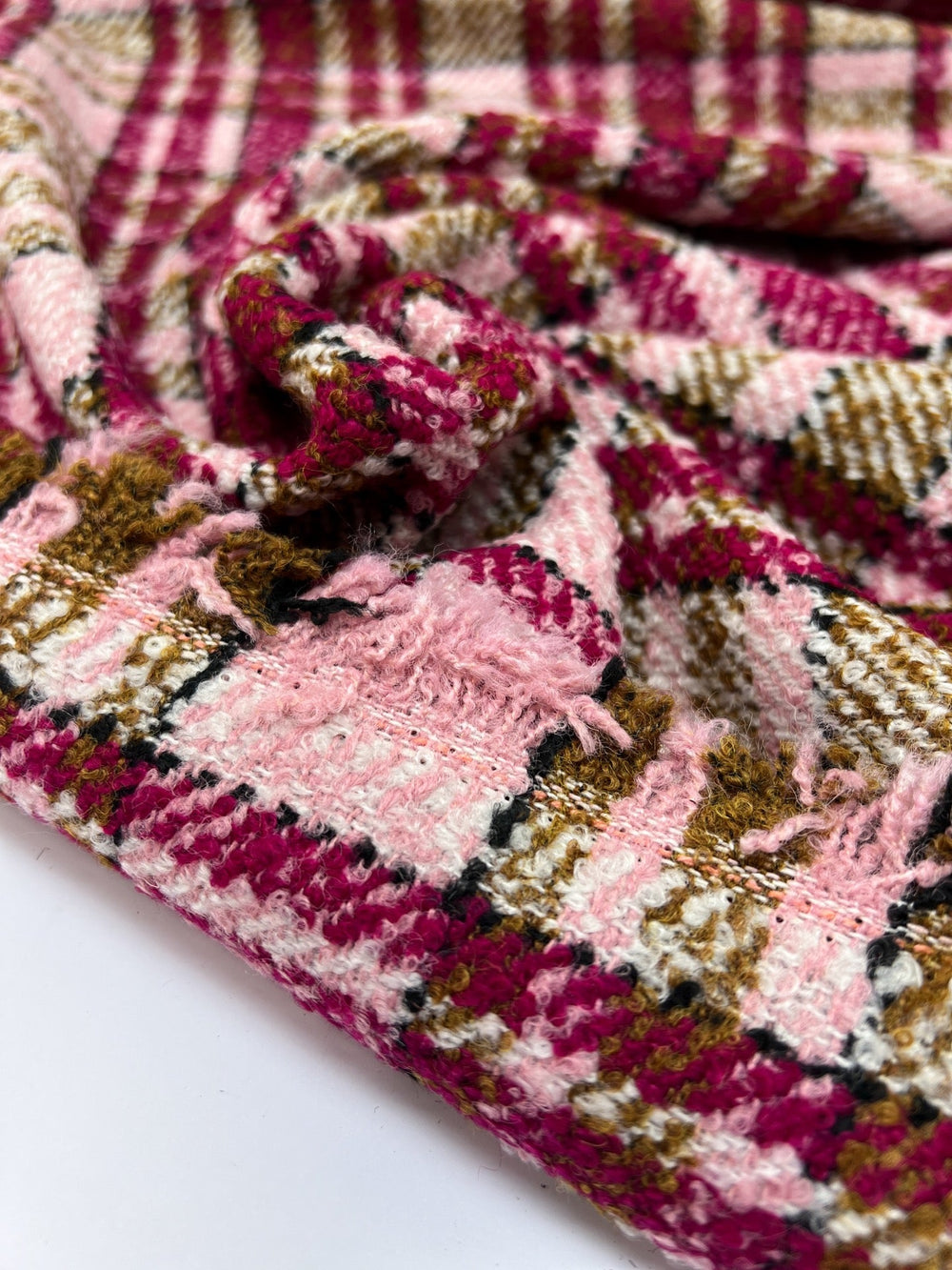 Italian bouclé suiting fabric in beige and pink plaid, medium-heavy acrylic polyamide blend, ideal for structured coats, skirts, and tailored suits.