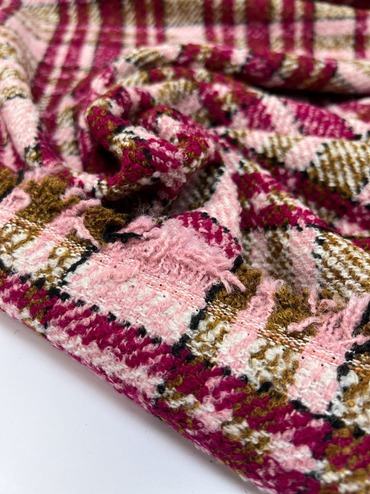 Italian bouclé suiting fabric in beige and pink plaid, medium-heavy acrylic polyamide blend, ideal for structured coats, skirts, and tailored suits.