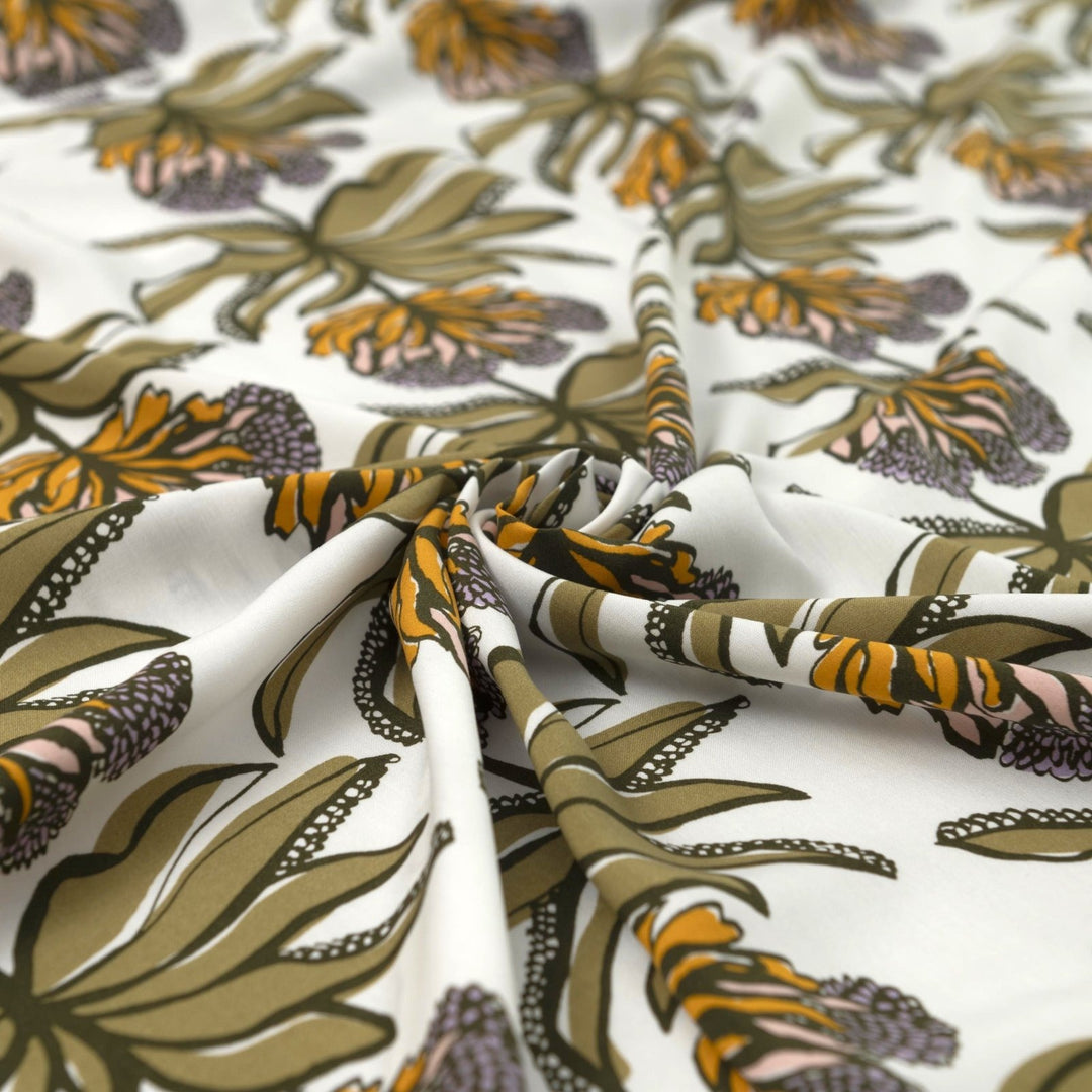 Ecovero Viscose Manifesto Ecru fabric by Nerida Hansen with botanical print in soft ecru and green, 58-inch wide, lightweight and drapey.