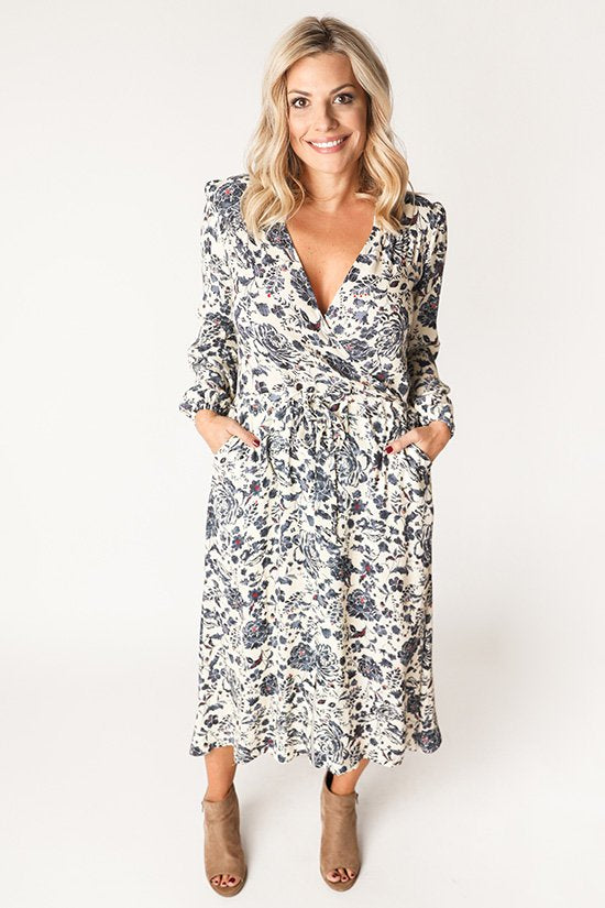Chalk & Notch Orchid Midi Dress sewing pattern featuring wrap bodice, flowing midi skirt, and sleeve options with ruffle or long gathered sleeves.