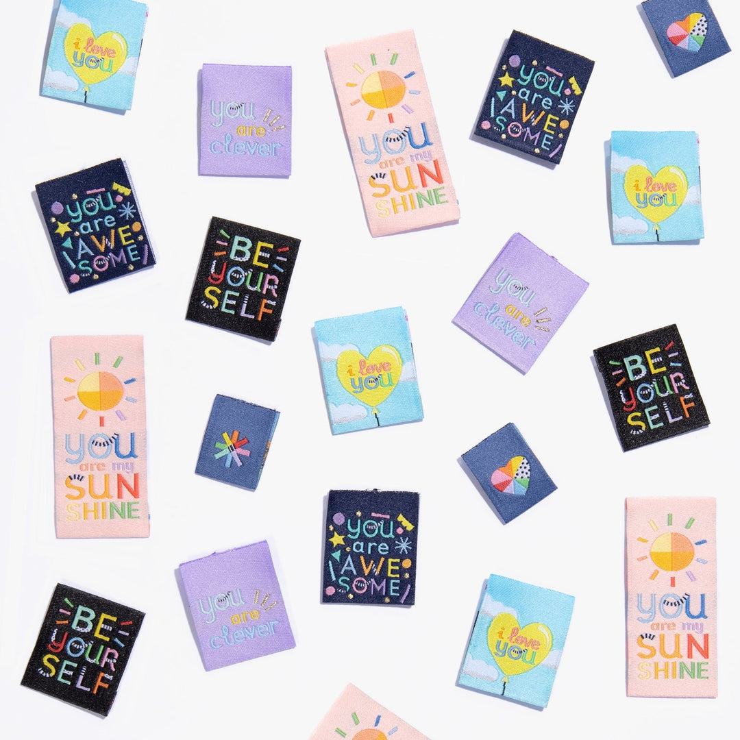 Kylie and the Machine Going Places kids’ labels by Brook Gossen – colorful woven tags and stickers with positive affirmations