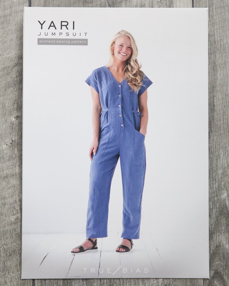 True Bias Yari Jumpsuit sewing pattern with V-neckline, angled patch pockets, button front, optional D-ring waist ties, and four view options