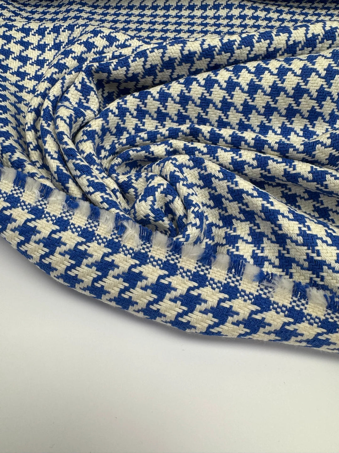 White and blue houndstooth tweed cotton blend fabric, Italian medium weight 61-inch wide, ideal for structured coats, dresses, skirts, and suits