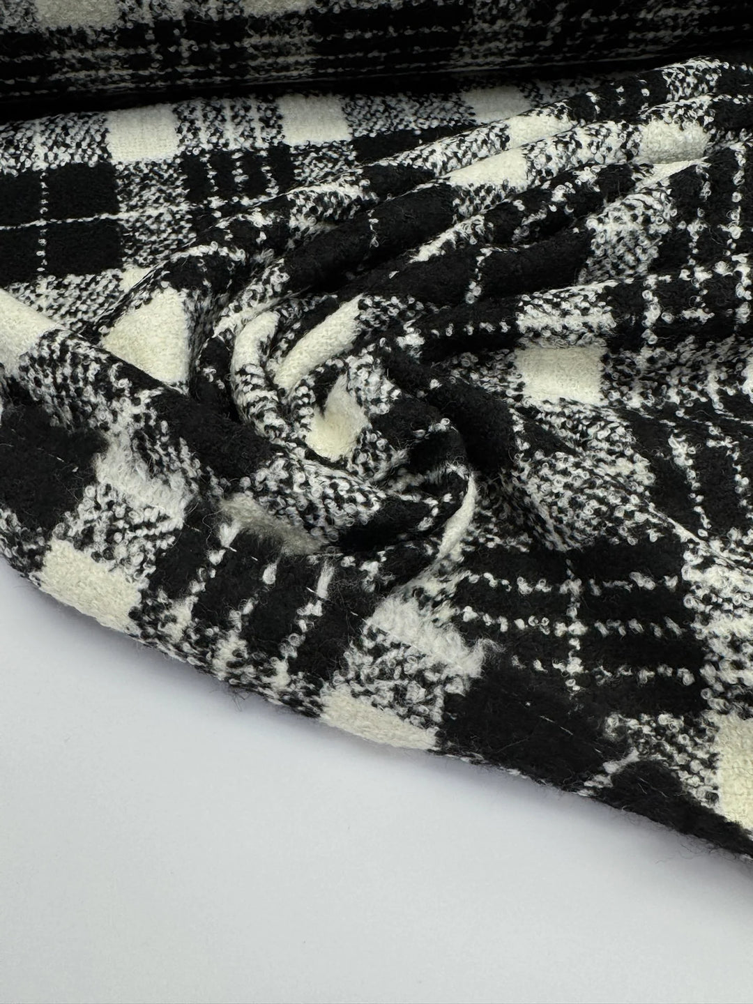Black and white plaid tweed bouclé wool blend fabric, Italian twill weave, 55-inch wide, ideal for coats, jackets, skirts, and tailored suits