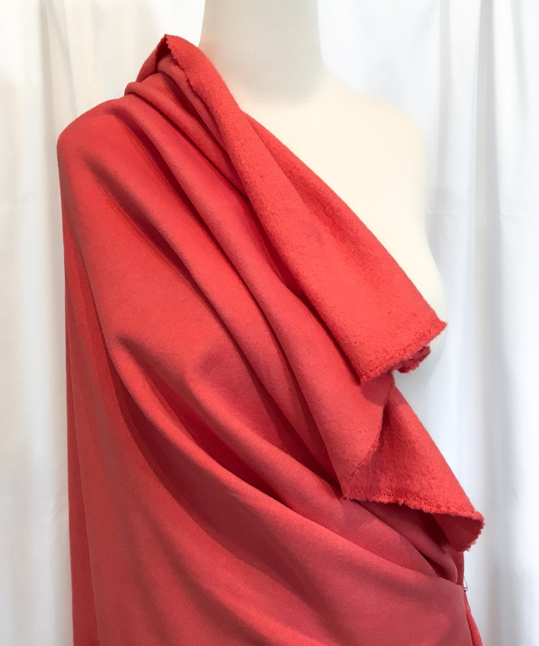 Coral Sweatshirt Brushed Fleece fabric with soft brushed texture and fluffy back, ideal for cozy apparel

