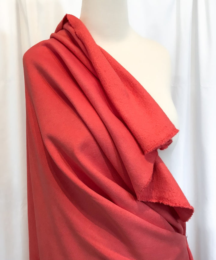 Coral Sweatshirt Brushed Fleece fabric with soft brushed texture and fluffy back, ideal for cozy apparel


