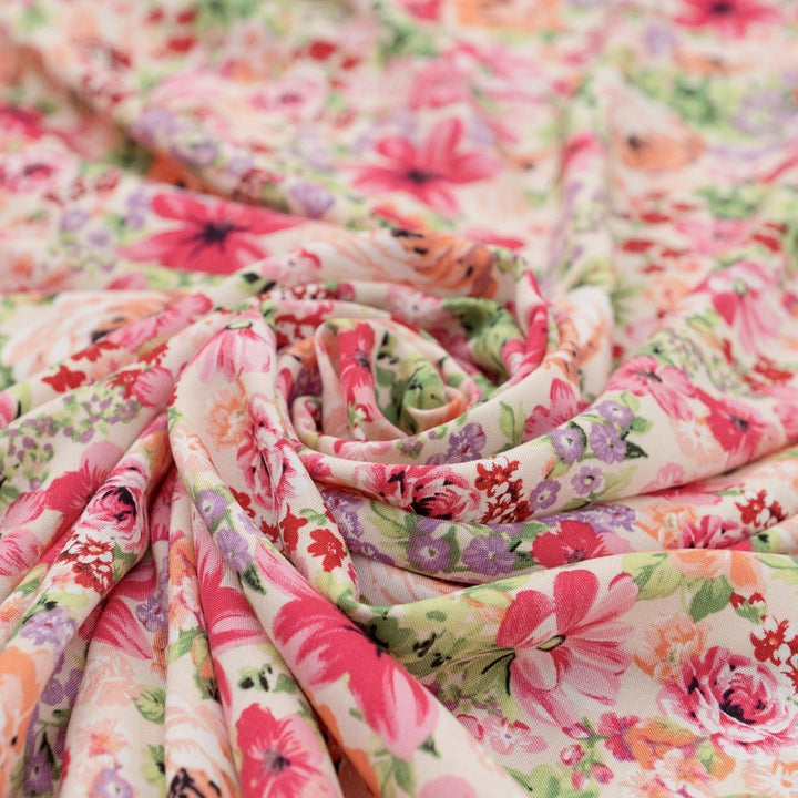 Viscose Challis Soft Spring Meadow fabric with pastel floral print in purple and pink – lightweight OEKO-TEX certified material for dresses, skirts, and blouses