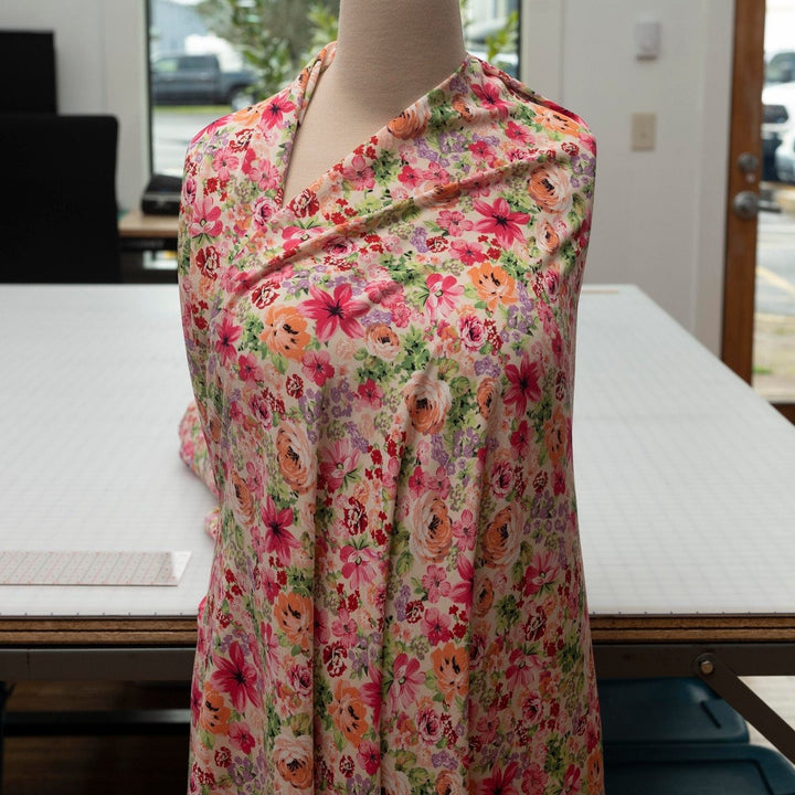 Viscose Challis Soft Spring Meadow fabric with pastel floral print in purple and pink – lightweight OEKO-TEX certified material for dresses, skirts, and blouses