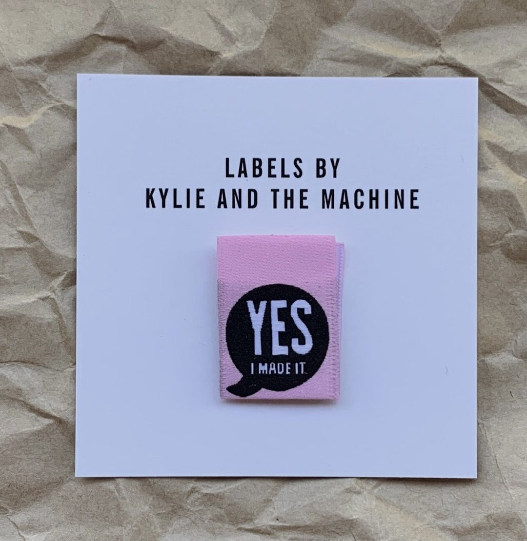 Bright pink 'Yes, I Made It' premium woven sewing labels for handmade garments and crafts