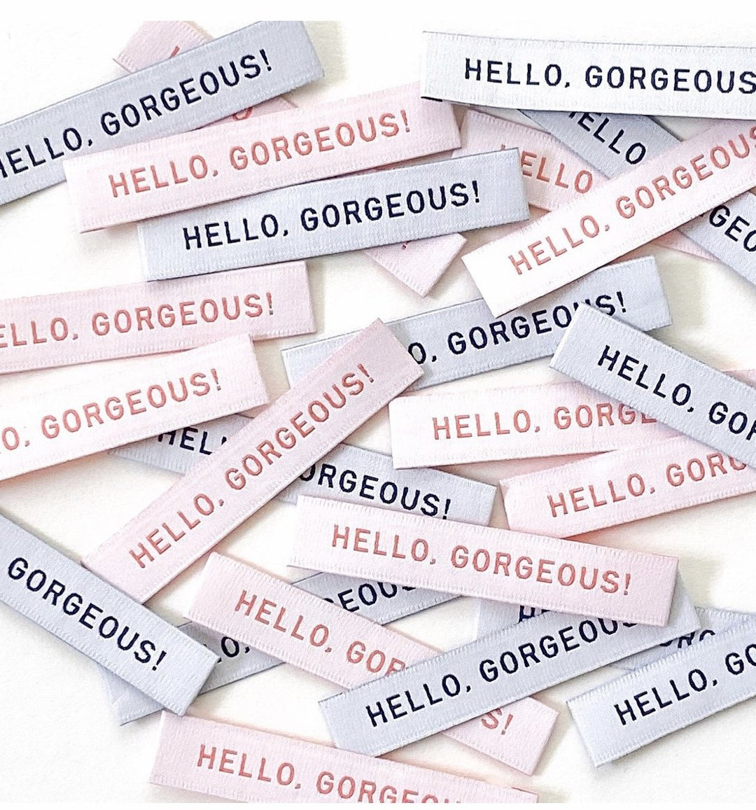 Professional 'MADE' woven labels in coral and navy - premium garment tags for handmade sewing projects