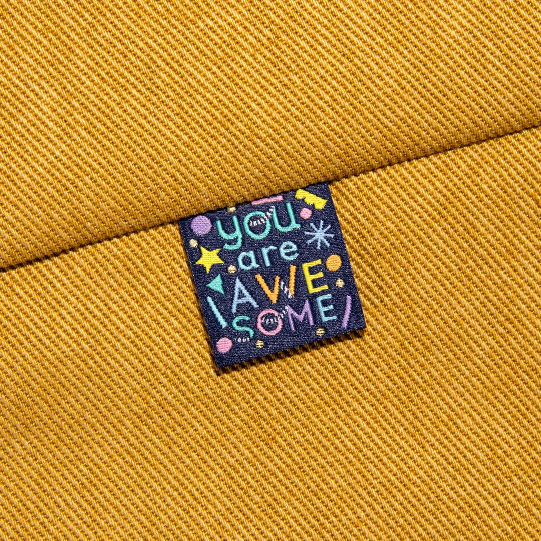 Kylie and the Machine Going Places kids’ labels by Brook Gossen – colorful woven tags and stickers with positive affirmations