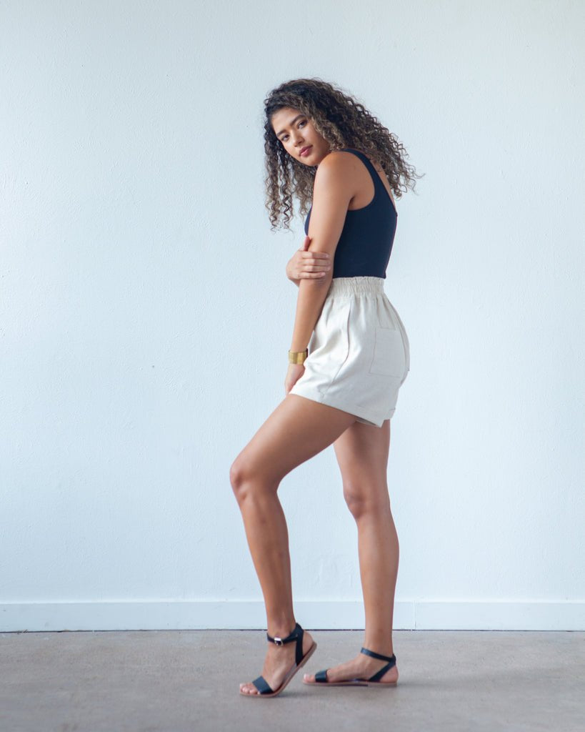True Bias Dani Short & Pant sewing pattern with shorts and ankle-length pant variations, paperbag waist, pockets, and cuffed hem in sizes 0–18.