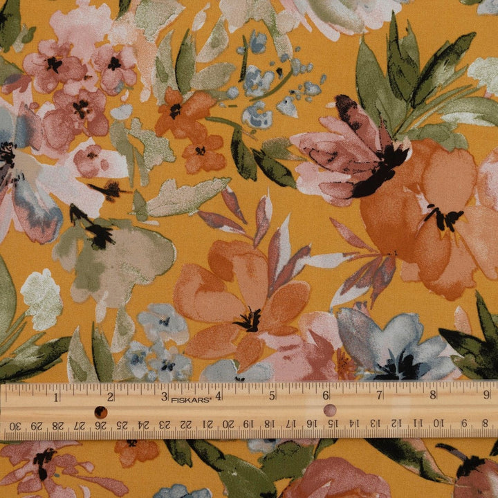 Rayon Poplin Golden Sunset Bloom fabric with marigold base, pumpkin, blue, and olive floral accents – 100% rayon sewing material