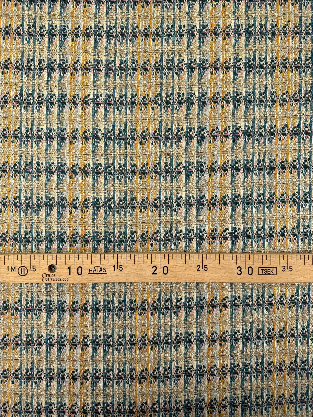 Italian tweed fabric with abstract plaid in beige, blue, and yellow tones, cotton wool blend, perfect for structured coats, suiting, and dresses.
