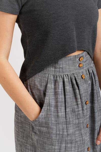 Megan Nielsen Briar sewing pattern featuring crop and standard-length tops, multiple sleeve options, patch pockets, and curved hem