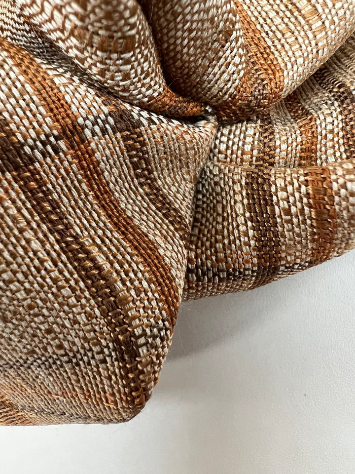 Italian plaid tweed fabric in browns and beige, viscose cotton blend, lightweight textile for structured coats, suiting, skirts, and dresses.