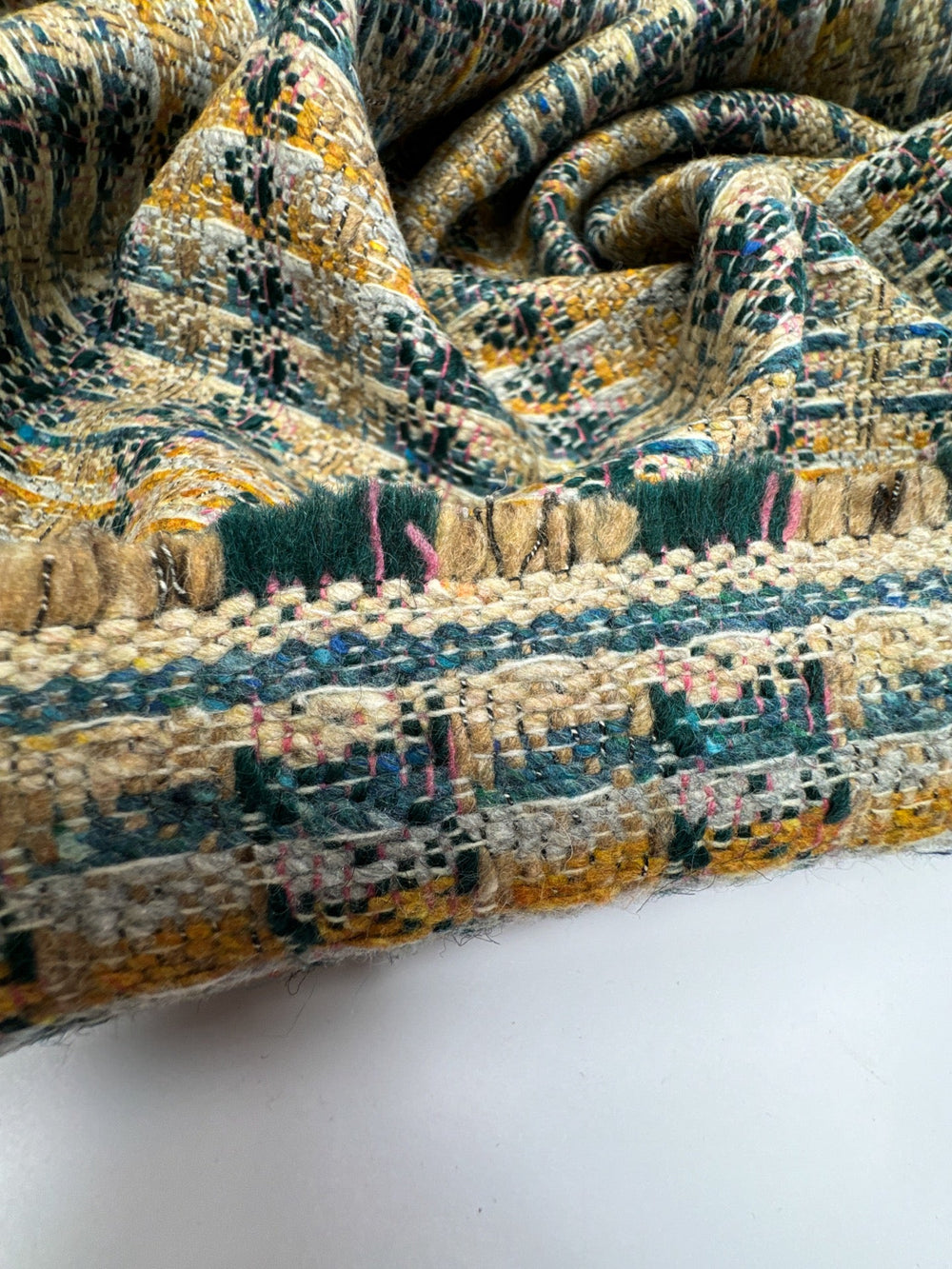 Italian tweed fabric with abstract plaid in beige, blue, and yellow tones, cotton wool blend, perfect for structured coats, suiting, and dresses.