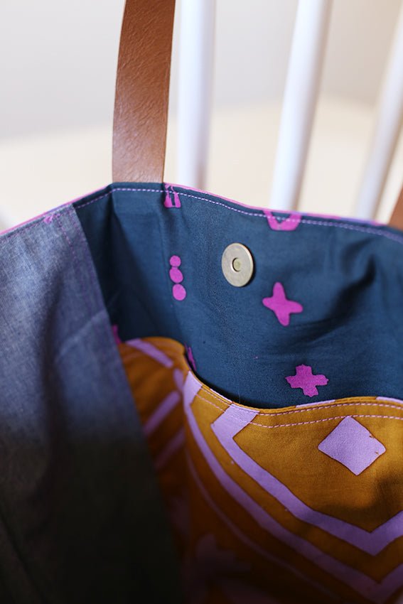 Noodlehead Caravan Tote and Pouch sewing pattern for DIY knitting bag with zippered pockets and matching accessory