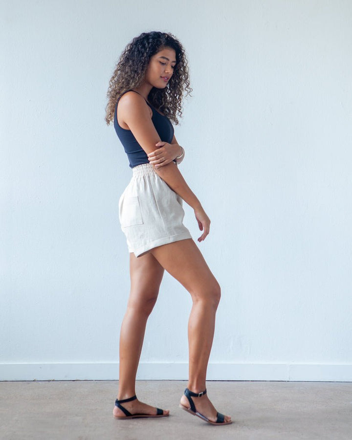 True Bias Dani Short & Pant sewing pattern with shorts and ankle-length pant variations, paperbag waist, pockets, and cuffed hem in sizes 0–18.