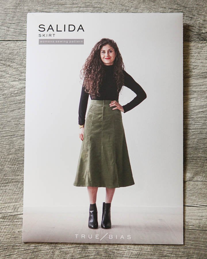 True Bias Salida Skirt pattern showing high-waist fitted knee-length and flared mid-calf skirt options with front zipper fly