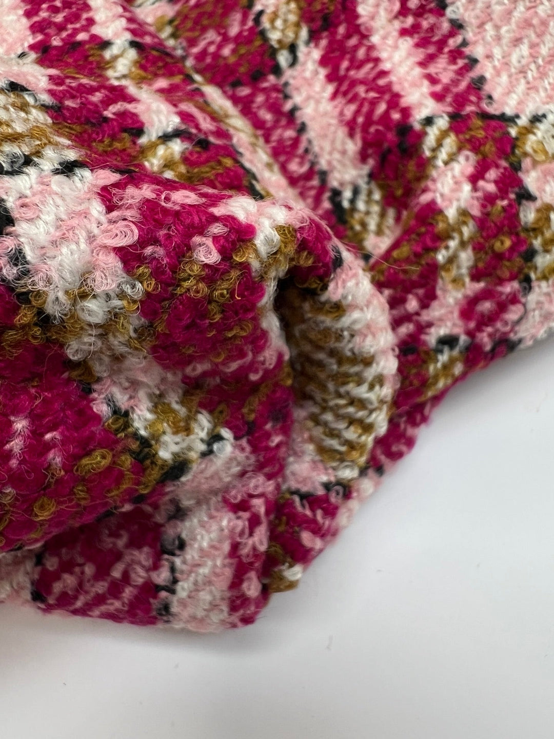 Italian bouclé suiting fabric in beige and pink plaid, medium-heavy acrylic polyamide blend, ideal for structured coats, skirts, and tailored suits.