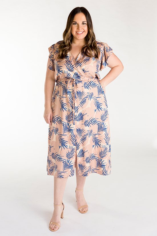 Chalk & Notch Orchid Midi Dress sewing pattern featuring wrap bodice, flowing midi skirt, and sleeve options with ruffle or long gathered sleeves.