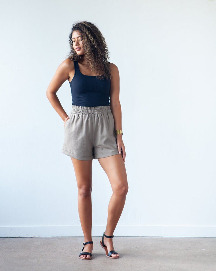 True Bias Dani Short & Pant sewing pattern with shorts and ankle-length pant variations, paperbag waist, pockets, and cuffed hem in sizes 0–18.