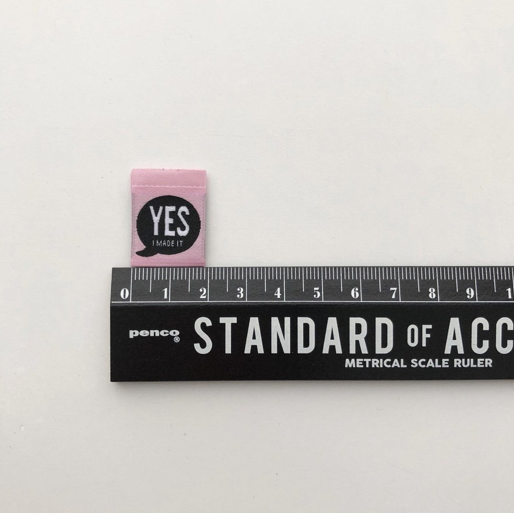 Bright pink 'Yes, I Made It' premium woven sewing labels for handmade garments and crafts