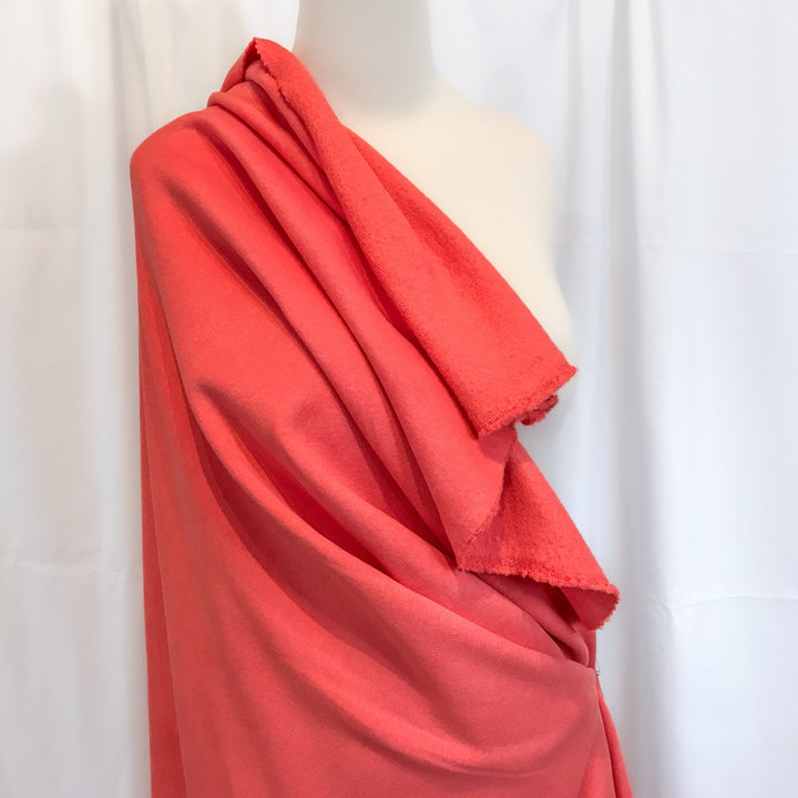Coral Sweatshirt Brushed Fleece fabric with soft brushed texture and fluffy back, ideal for cozy apparel

