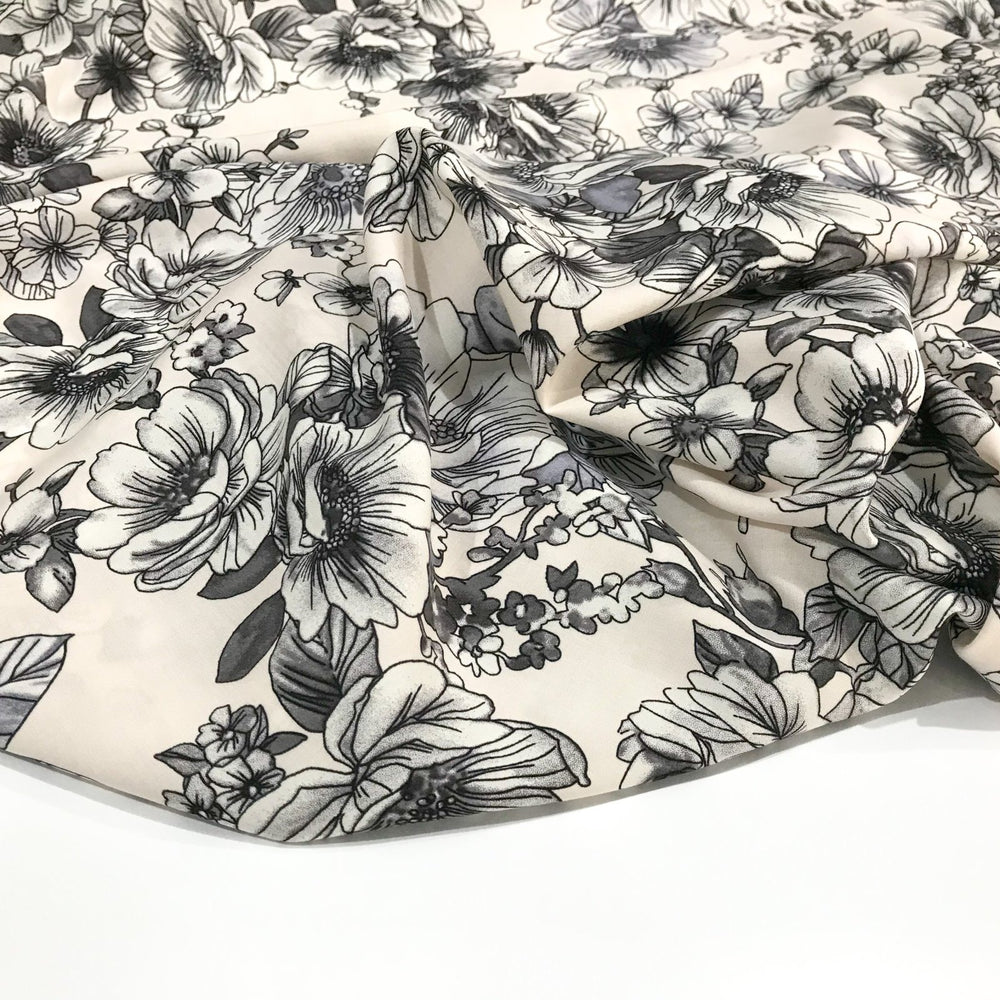 Rayon Challis Graphite Floral fabric with grayscale floral pattern on cream background, soft and lightweight for sewing projects