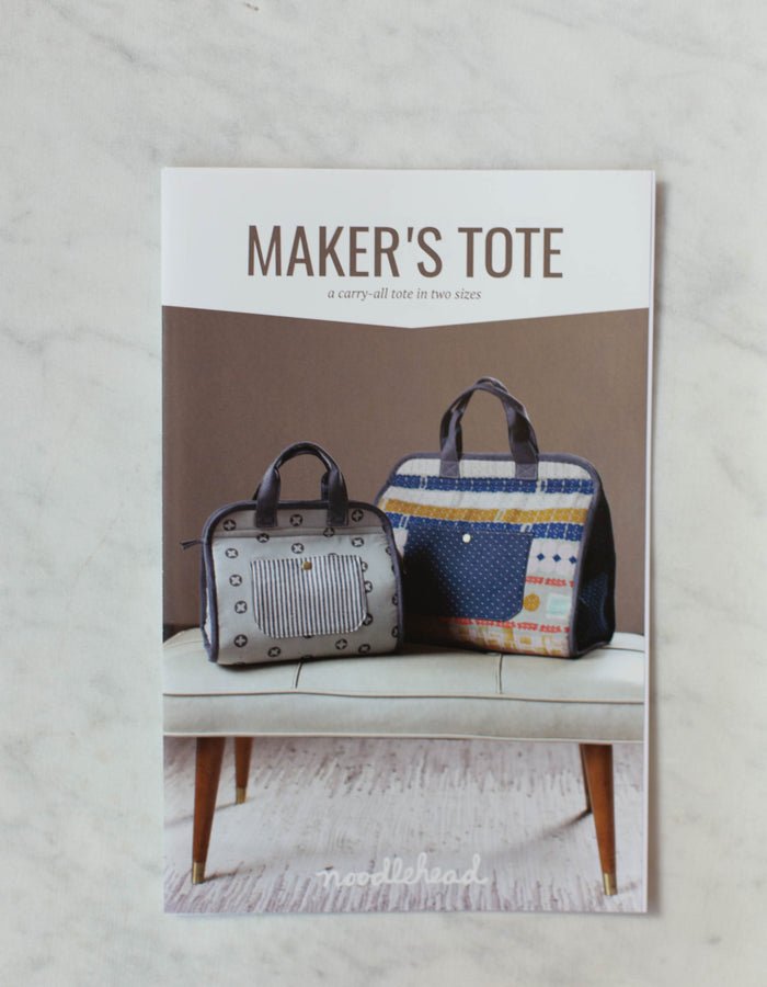 Noodlehead Maker’s Tote sewing pattern for DIY craft organizer bag with zippered pockets and two sizes