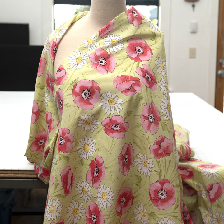 Cotton Lawn Spring Blossom – 100% cotton, 56 inches wide, lightweight breathable fabric with pink and red floral prints for blouses, dresses, and skirts