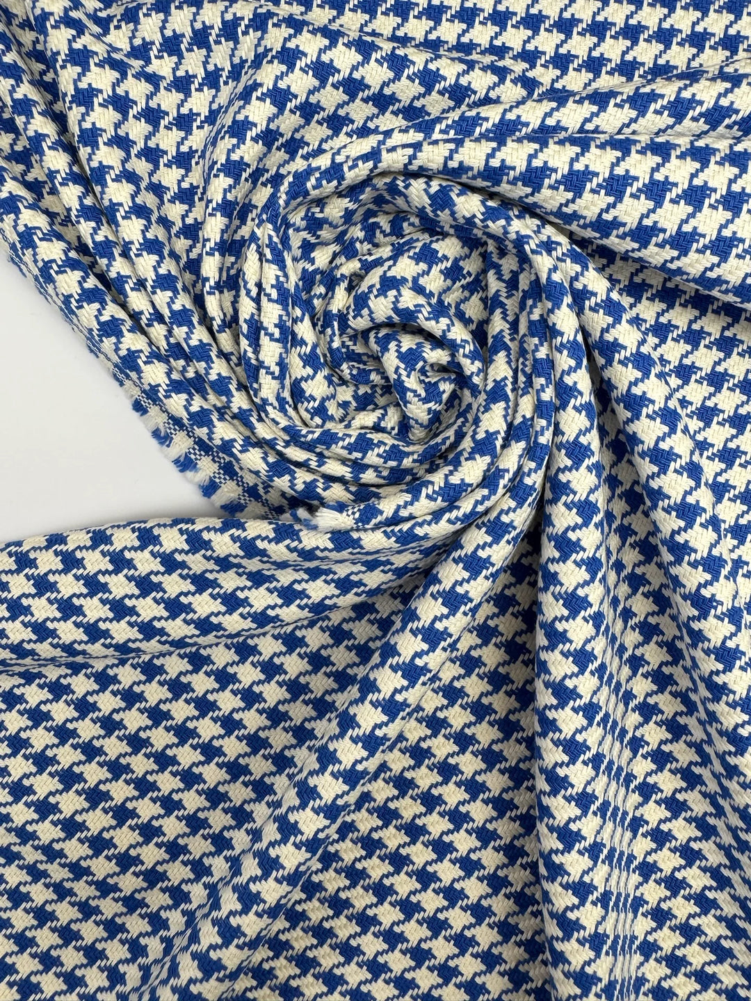 White and blue houndstooth tweed cotton blend fabric, Italian medium weight 61-inch wide, ideal for structured coats, dresses, skirts, and suits