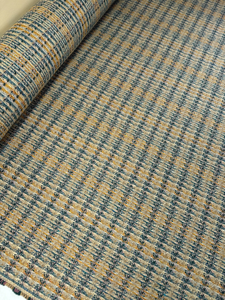 Italian tweed fabric with abstract plaid in beige, blue, and yellow tones, cotton wool blend, perfect for structured coats, suiting, and dresses.