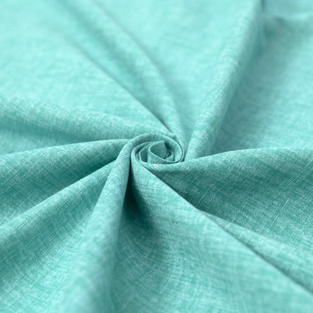 Japanese Dobby Heathered in Teal cotton fabric with textured weave