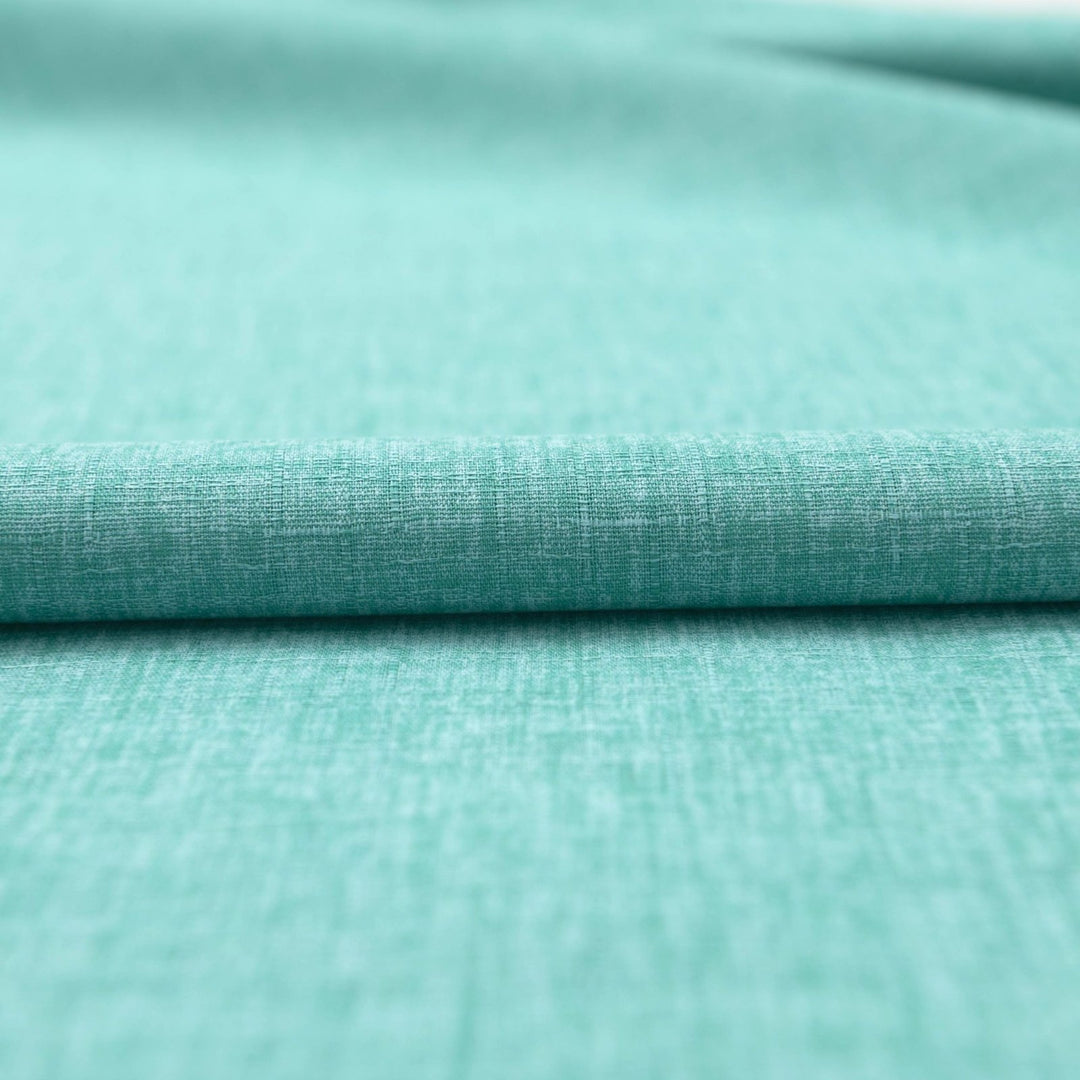 Japanese Dobby Heathered in Teal cotton fabric with textured weave