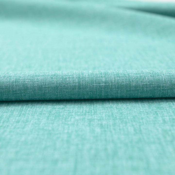 Japanese Dobby Heathered in Teal cotton fabric with textured weave