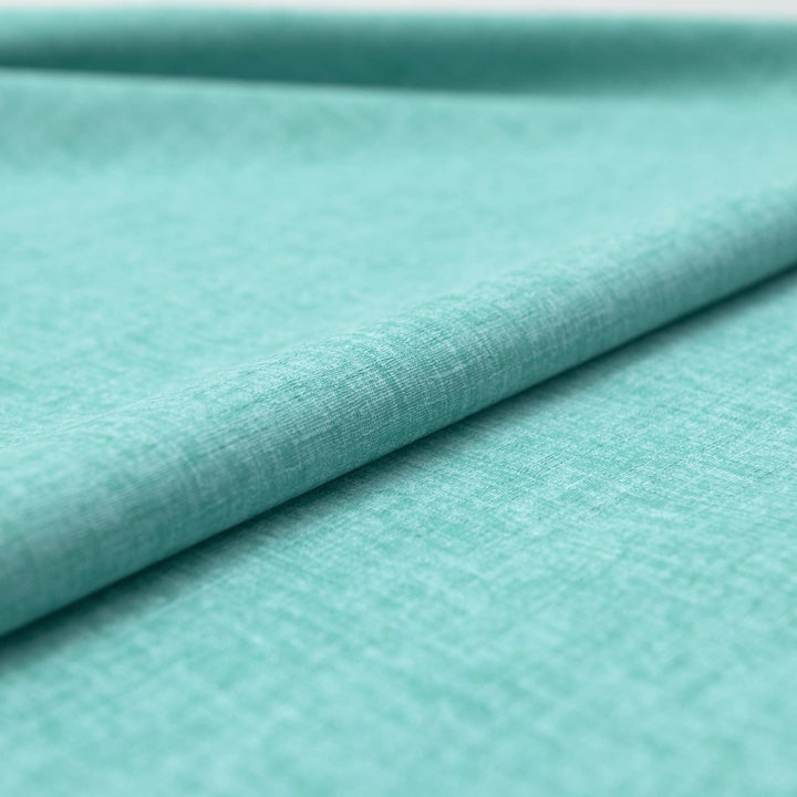 Japanese Dobby Heathered in Teal cotton fabric with textured weave