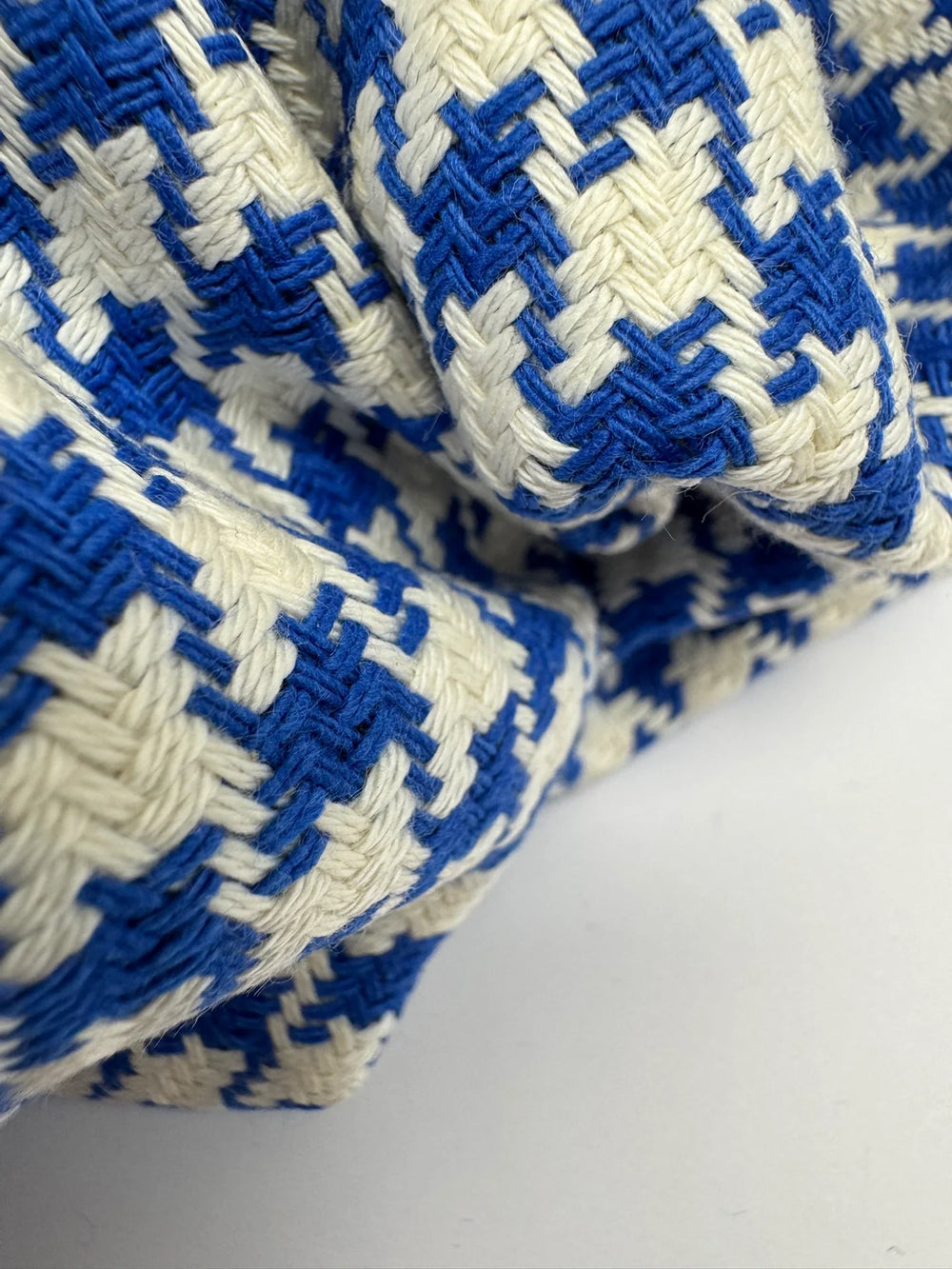 White and blue houndstooth tweed cotton blend fabric, Italian medium weight 61-inch wide, ideal for structured coats, dresses, skirts, and suits