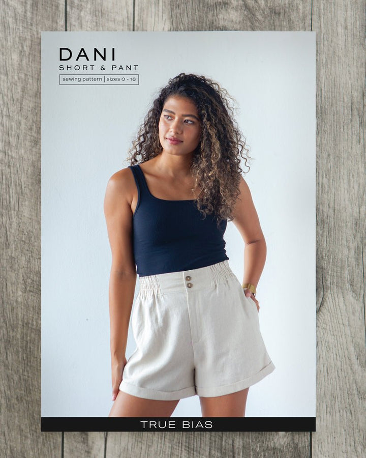 True Bias Dani Short & Pant sewing pattern with shorts and ankle-length pant variations, paperbag waist, pockets, and cuffed hem in sizes 0–18.