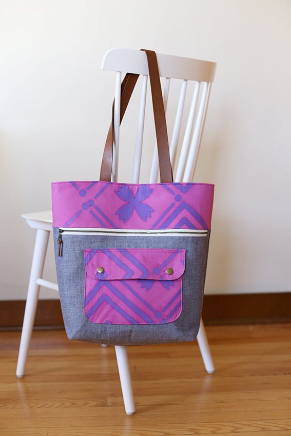 Noodlehead Caravan Tote and Pouch sewing pattern for DIY knitting bag with zippered pockets and matching accessory
