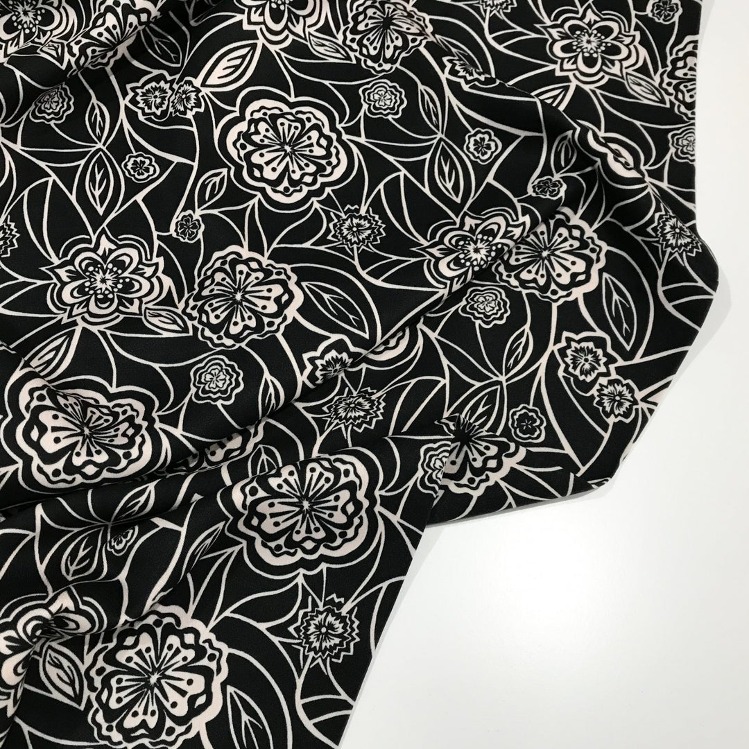 Organic Tencel Twill Rowdy Patch Black fabric with whimsical digital print, eco-friendly GOTS-certified inks, fluid drape, and luxury twill texture