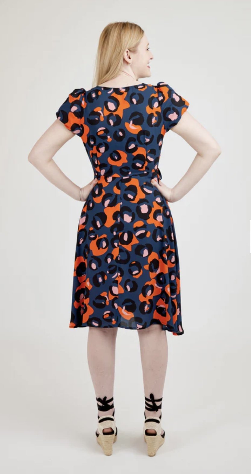 Cashmerette Roseclair Dress sewing pattern with wrap design, three sleeve and skirt variations, and curve-friendly fit in sizes 0–32.