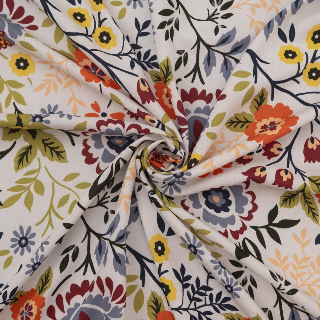 “Rayon Challis – Bright Floral fabric with white base and bold colorful floral print, lightweight and breathable 100% rayon, ideal for dresses, skirts, blouses, and scarves.”