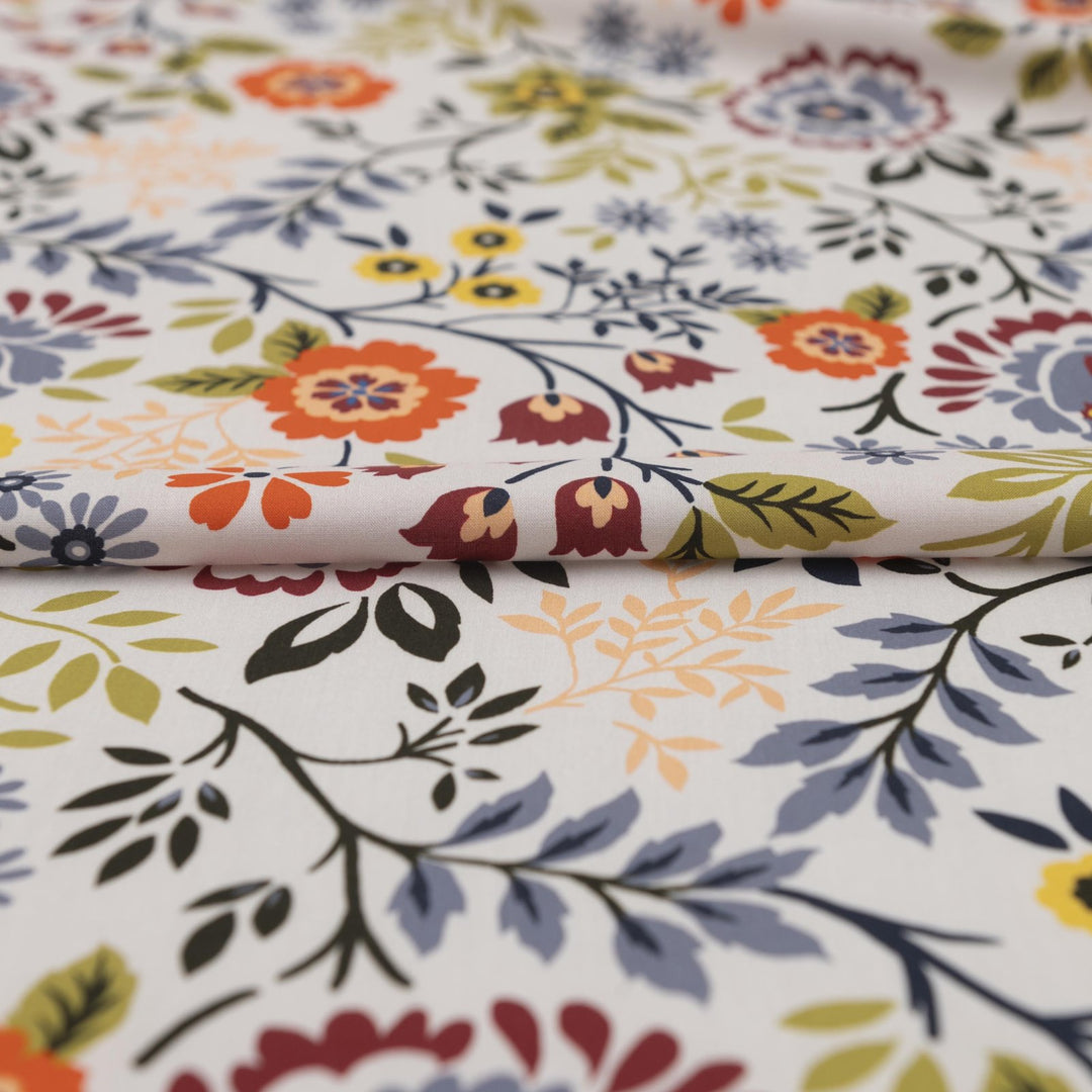 “Rayon Challis – Bright Floral fabric with white base and bold colorful floral print, lightweight and breathable 100% rayon, ideal for dresses, skirts, blouses, and scarves.”