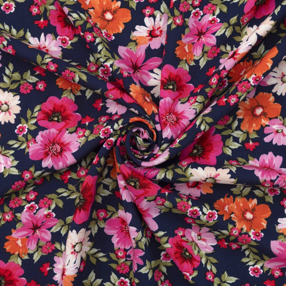 Rayon Challis Navy Floral Oasis medium-weight fabric with vibrant pink and blue florals on navy base